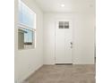 Inviting entryway with tile flooring, a window letting in natural light, and a white front door at 2680 E Santa Rosalia Dr, Casa Grande, AZ 85194
