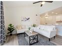 Bright living room with vaulted ceiling, ceiling fan, contemporary furniture, and lots of natural light at 623 W Guadalupe Rd # 288, Mesa, AZ 85210