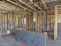 Exposed beams and newly installed insulation inside new construction home at 7700 W Saddlehorn Rd, Peoria, AZ 85383