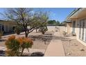 Exterior view of home and landscaped yard featuring desert plants and decorative gravel at 10039 W Lancaster Dr, Sun City, AZ 85351