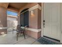Inviting covered front porch with seating, perfect for relaxing outdoors at 10583 S 175Th Ave, Goodyear, AZ 85338