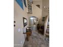 Spacious entryway with decor and views into other rooms of the house at 12237 W Sherman St, Avondale, AZ 85323