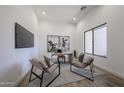 Bright office space featuring modern decor, a large window, and wood-look tile floors at 1250 E Smokehouse Trl, Phoenix, AZ 85085