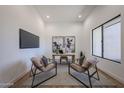 Bright office space featuring modern decor, a large window, and wood-look tile floors at 1250 E Smokehouse Trl, Phoenix, AZ 85085