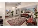 Open-concept living room with stylish furnishings and decor, with a partial view of the second floor at 13313 W Palo Verde Dr, Litchfield Park, AZ 85340