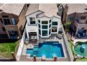 An overhead view of the refreshing swimming pool and seating area in a private backyard at 16610 S 21 St, Phoenix, AZ 85048
