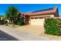 Well-maintained home featuring desert landscaping, a two-car garage and solar panels for energy efficiency at 17139 S 174Th Dr, Goodyear, AZ 85338