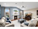 Comfortable living room with a fireplace and vaulted ceilings offers a relaxing atmosphere at 29227 N 44Th St, Cave Creek, AZ 85331