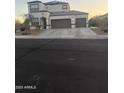 This home features a three-car garage, stucco siding, desert landscaping, and a concrete driveway at 3012 N 310Th Ln, Buckeye, AZ 85396