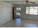 Bright living room with tile flooring and lots of natural light at 3419 W Glenn Dr, Phoenix, AZ 85051