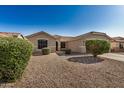 Inviting single-story home with desert landscaping in front, featuring low-water plants at 3885 E Lambeth Pl, San Tan Valley, AZ 85140