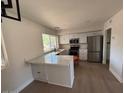 Bright kitchen with stainless steel appliances and white cabinets at 4309 E Alta Mesa Ave, Phoenix, AZ 85044