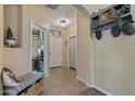 Cozy entryway featuring a bench, decorative shelf, and tiled floor at 4617 W Cottontail Rd, Phoenix, AZ 85086