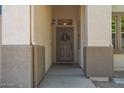 Covered front entryway with a decorative wreath adorning the brown front door at 4617 W Cottontail Rd, Phoenix, AZ 85086