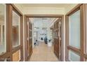 Open foyer with high ceilings, wood floors, and bright, airy living space at 4618 E Valley View Dr, Phoenix, AZ 85044
