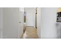 Bright hallway featuring tile flooring and a view of the front door at 811 W 13Th St, Tempe, AZ 85281