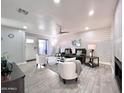 Spacious living room with contemporary decor, a ceiling fan, and easy access to the patio at 850 S River Dr # 1085, Tempe, AZ 85281