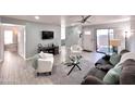 Open concept living room with stylish decor and ample seating at 850 S River Dr # 1085, Tempe, AZ 85281