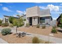 Charming single-Gathering home boasts modern architecture with stone accents and drought-tolerant landscaping at 948 E La Mirada Dr, Phoenix, AZ 85042