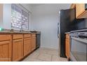 Bright kitchen with stainless steel appliances, stone countertops, and neutral tile flooring at 11333 N 92Nd St # 1085, Scottsdale, AZ 85260