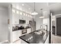 Modern kitchen with stainless steel appliances, granite countertops, and subway tile backsplash at 13700 N Fountain Hills Blvd # 135, Fountain Hills, AZ 85268
