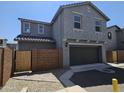 Attractive two-story home with a two-car garage and a private brick-walled yard, perfect for outdoor activities at 14224 W Hackamore Dr, Surprise, AZ 85387