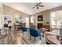 Comfortable living room features modern furniture, wood floors, and a cozy fireplace at 14250 W Wigwam Blvd # 2126, Litchfield Park, AZ 85340