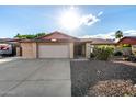Charming brick home featuring a two-car garage and well-maintained front yard at 16638 N 46Th Ln, Glendale, AZ 85306