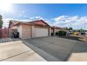 Lovely home with a spacious driveway, a two-car garage, and a tidy front yard at 16638 N 46Th Ln, Glendale, AZ 85306
