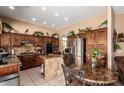 Cozy kitchen with stainless steel appliances, tile backsplash, and granite countertops at 22026 N 44Th Pl, Phoenix, AZ 85050