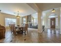 Elegant dining room featuring a chandelier and a view of the living room at 27316 N Covered Wagon Rd, Phoenix, AZ 85085