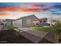 Landscaped backyard features green grass and a covered patio perfect for outdoor living at 3187 E Pineapple Rd, San Tan Valley, AZ 85143
