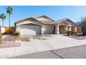 Attractive home with a three-car garage, a long driveway and well maintained landscaping and desert rock at 3206 W Knudsen Dr, Phoenix, AZ 85027