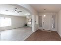 Open-concept living room featuring neutral paint, tile and laminate flooring and plenty of natural light at 3206 W Knudsen Dr, Phoenix, AZ 85027