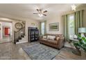 Inviting living room showcases hardwood style floors and staircase leading to the second floor at 5012 S Girard St, Gilbert, AZ 85298