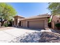 Lovely single-story home featuring a three-car garage and mature landscaping at 5185 W Del Rio St, Chandler, AZ 85226