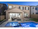 Backyard patio featuring a pool with accent lighting, stylish outdoor furniture, and covered patio space at 634 E Deer Creek Rd, Phoenix, AZ 85048