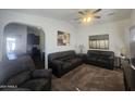 Comfortable living room with plush sofas, neutral paint, and large windows for natural light at 650 N Hawes Rd # 3123, Mesa, AZ 85207