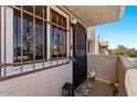 Charming front entrance with security door, decorative goose, and lantern at 7129 E Broadway Rd # 72, Mesa, AZ 85208