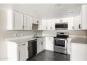 Bright updated kitchen with stainless steel appliances, white cabinets and countertop at 7920 E Camelback Rd # 110, Scottsdale, AZ 85251