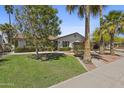 Beautiful home featuring a lush lawn and mature shade trees, complemented by a well-manicured landscape at 8036 N 17Th Dr, Phoenix, AZ 85021