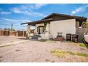 Charming home featuring a stucco exterior, covered porch, and low-maintenance gravel landscaping at 1505 W Fillmore St, Phoenix, AZ 85007