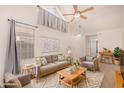 Bright living room with vaulted ceilings, a ceiling fan, and contemporary furnishings at 1822 S 39Th St # 7, Mesa, AZ 85206