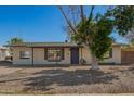 Charming single-story home with a well-maintained front yard and inviting entrance at 1919 W Fairmount Ave, Phoenix, AZ 85015