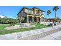 Beautifully landscaped front yard with mature trees and stone features enhancing curb appeal at 248 S 167Th Dr, Goodyear, AZ 85338