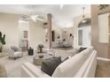 Bright living room featuring vaulted ceilings and an open layout to the dining area for seamless entertaining at 2753 E Kenwood St, Mesa, AZ 85213