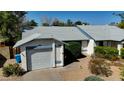 A single-story house featuring a one car garage and desert landscaping at 3106 W Mohawk Ln, Phoenix, AZ 85027