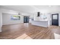 Open living room showcasing beautiful flooring and natural light, creating an inviting atmosphere at 3231 W Willow Ave, Phoenix, AZ 85029