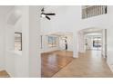 Open concept living area with tile and wood flooring and white walls at 3370 E Flamingo Ct, Gilbert, AZ 85297