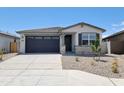 Charming single-story home showcasing stone accents, low-maintenance landscaping, and a two-car garage at 37069 W Prado St, Maricopa, AZ 85138